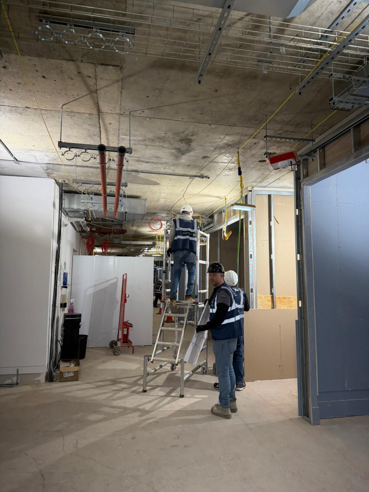 High-level pipework and containment installation in progress