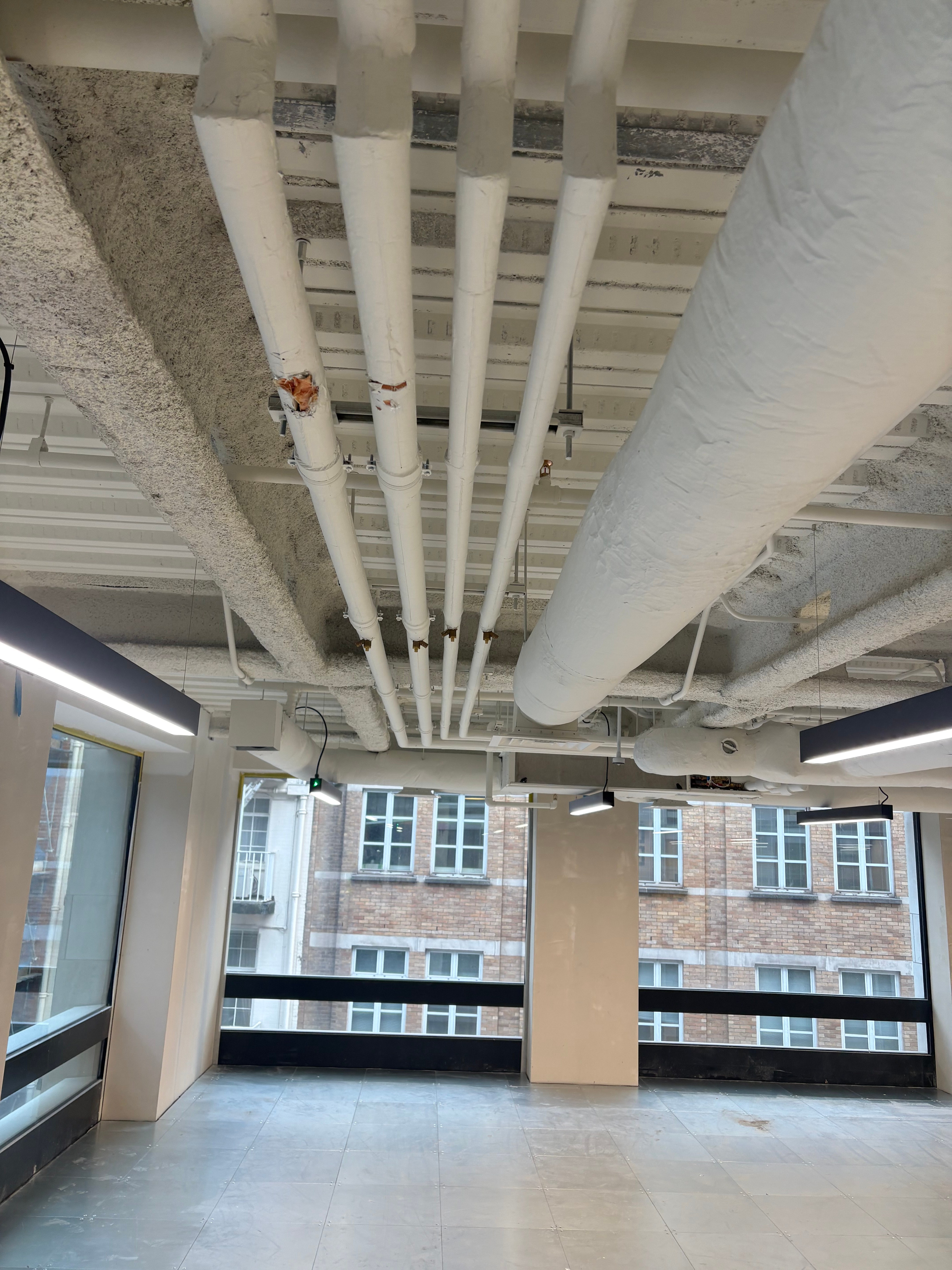 Finished office space with exposed ceiling