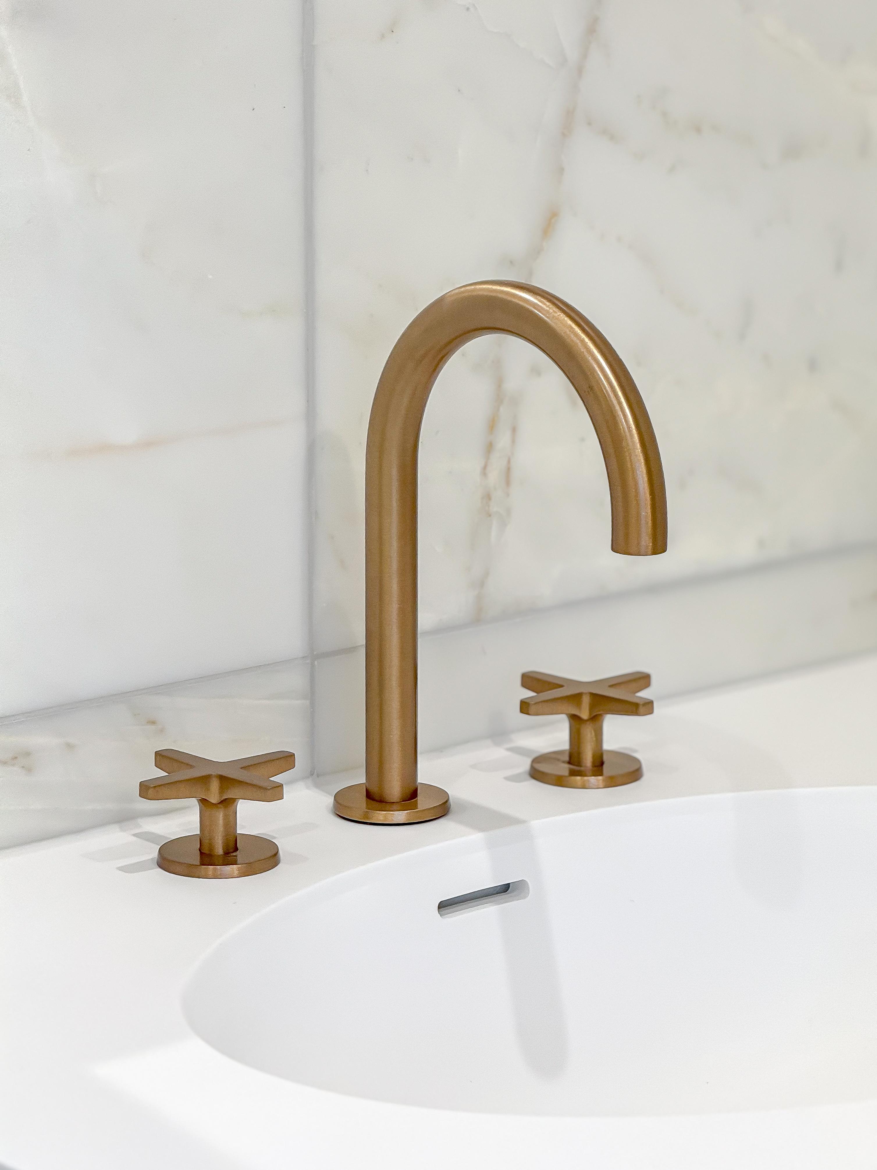 Brass bathroom faucet with cross handles
